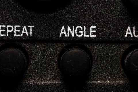 Tv angle icon and button close up of a old dusty black Television remote co.. Stock Photos