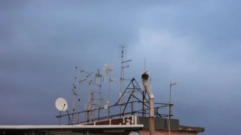 TV antennas with clouds. Time Lapse. Stock Footage 256239967