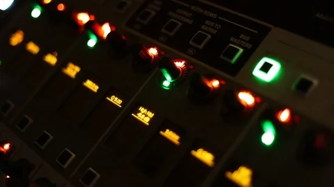 TV Audio mixer panel with equalizers controlling levels of audio during a Stock Footage