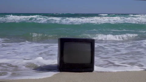 A TV on the beach. Breaking waves on the background. For TV mockup. Stock Footage 130188681