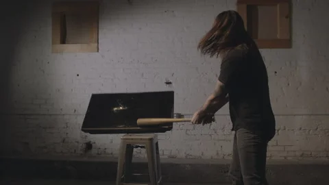 Tv Being Smashed by an Angry Man with a Bat Stock-Footage 208798760