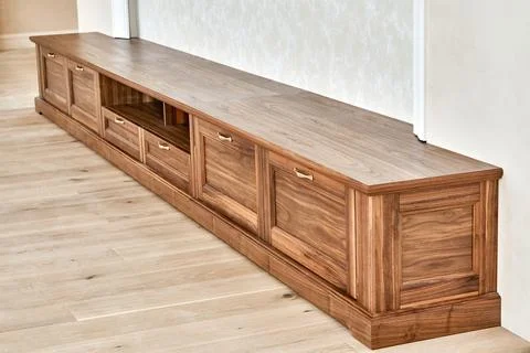 TV cabinet of veneer and solid walnut Stock Photos