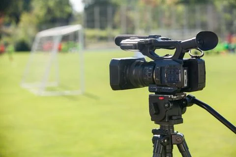 TV camera at the stadium, broadcasting during a football (soccer) match Stock-Fotos