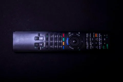 TV control on a black background. Multi control concept. Remote control. Blac Stock Photos