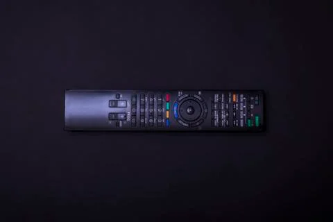 TV control on a black background. Multi control concept. Remote control. Blac Foto stock