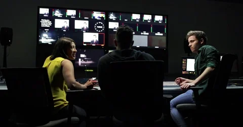 TV crew having meeting in control room Stock Footage 82120398
