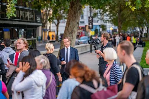 TV crew interviewing people in the queue on South Bank to see the Queen Stock Photos