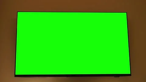 A TV with a green screen for chroma key, ready for digital editing. The scene Stock Footage 330796210