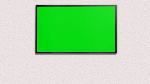 TV with green screen is switched on with remote control 스톡 동영상 73293190
