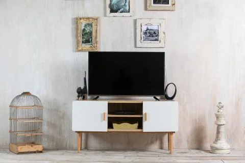 TV in the interior in loft style on the bedside table Stock Photos