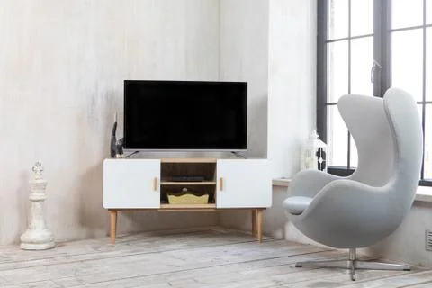 TV in the interior in loft style on the bedside table Stock Photos