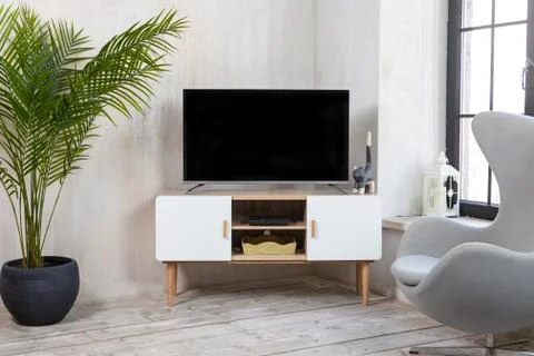 TV in the interior in loft style on the bedside table Stock Photos