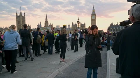 TV News crews report on Queue to see Queen lying in state Stock Footage 212988984