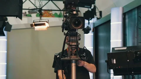 TV operator install video camera for shooting Stock Footage 75950573