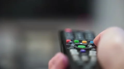 The TV remote buttons close-up. Entertainment on the couch. Switching TV Video stock 155277370