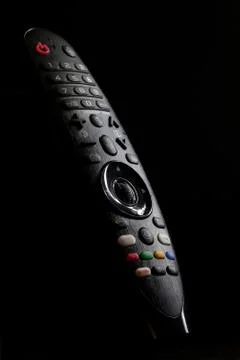 Tv Remote Control And Shadows Stock Photos