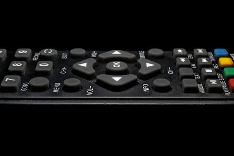 TV remote control on a black background close-up Stock Photos