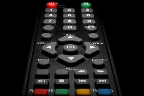 TV remote control on a black background close-up Stock Photos