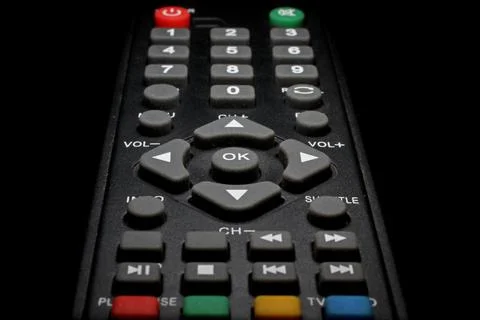 TV remote control on a black background close-up Stock Photos