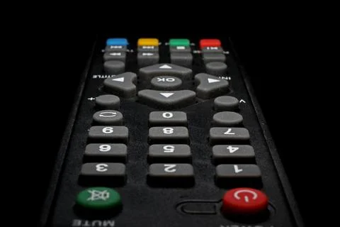 TV remote control on a black background close-up Stock Photos