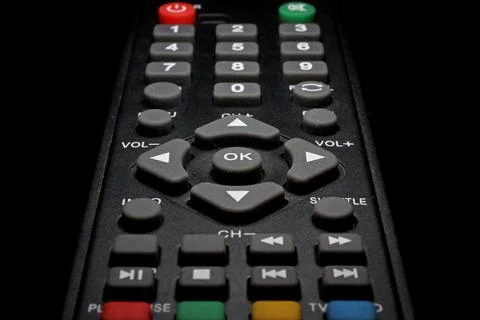 TV remote control on a black background close-up Stock Photos