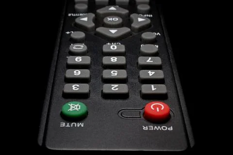 TV remote control on a black background close-up Stock Photos