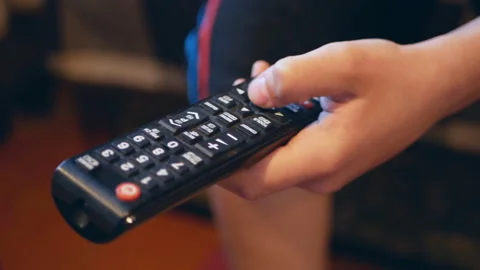 TV remote control close-up. Change channels on the TV remote Stock Footage 108328104