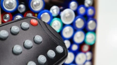 TV remote control with disposable AAA and AA alkaline batteries. Battery repl 스톡 사진