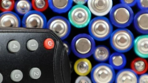 TV remote control with disposable AAA and AA alkaline batteries. Battery repl 写真素材