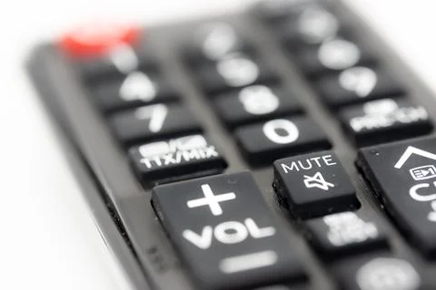 TV remote control with focus on volume and mute buttons, concept of deafness Stock Photos