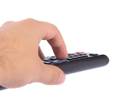 TV remote control in hand Stock Photos