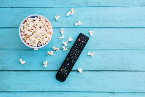 Tv remote control popcorn. High quality and resolution beautiful photo concep Фото