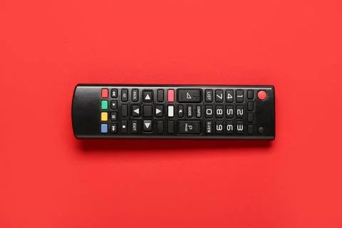 TV remote control on red background Stock Photos
