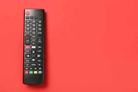 TV remote control on red background Stock Photos