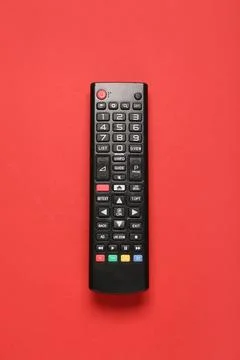 TV remote control on red background Stock Photos