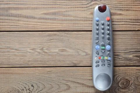 TV remote control on a wooden table. Copy space. Top view. Stock Photos