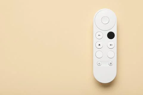 TV remote controller on beige background 库存照片