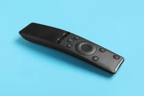 TV remote controller on blue background 库存照片