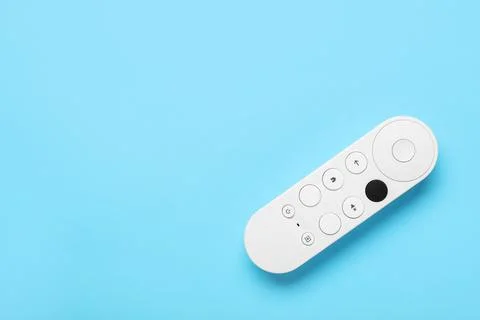 TV remote controller on blue background 库存照片