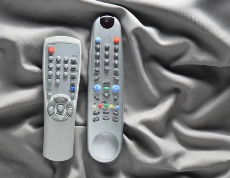 TV remote controls on a silk background. 写真素材