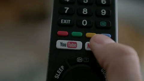 Tv remote with netflix youtube button Stock Footage 120727197