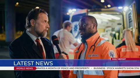 TV Reporter Does Interview with Ambulance Worker Stock Footage 145692547