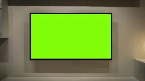 TV screen mockup background. Lcd tv monitor with blank green screen in living Stock Footage 341392856