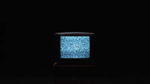 TV screen on at night with a white noise. Stock. Static noise on the old TV Stock Footage