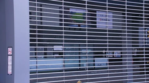 TV Screen Plays in Closed Kyoto Station During Typhoon Jebi Cleanup Stock Footage 100577219