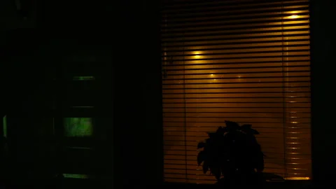 The TV screen is reflected on the ceramic wall tiles, a foggy night can be seen Vídeo Stock 221614356