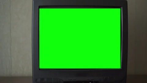 TV-set with bright green chroma key screen stands at wall Stock Footage 120245937