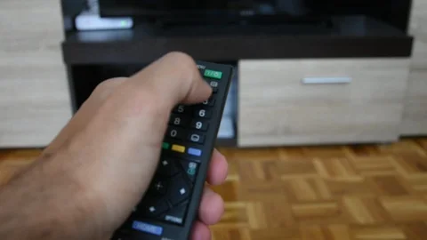 Tv starting with remote Stock Footage 129556751
