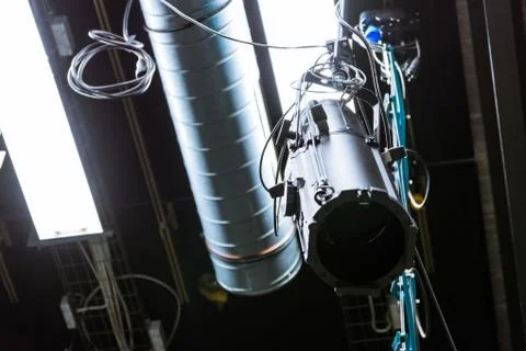TV Studio Single Light Hanging Above Flourescent Idle Turned Off Equipment Te Stock Photos