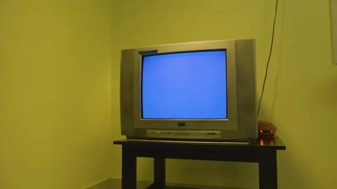 TV switches from Front view to Side view on a blue screen 4k short Stock-Footage 252211736